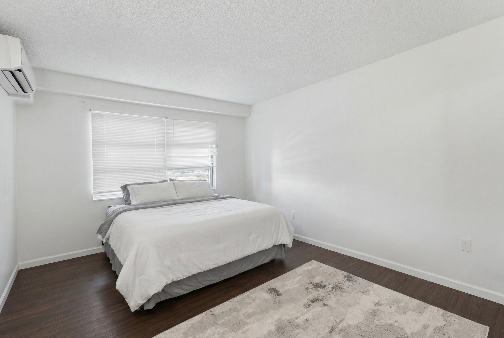 Second bedroom with king bed and large window