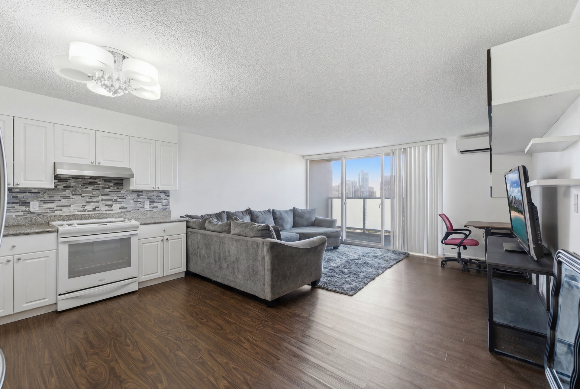 Living room and kitchen with city view