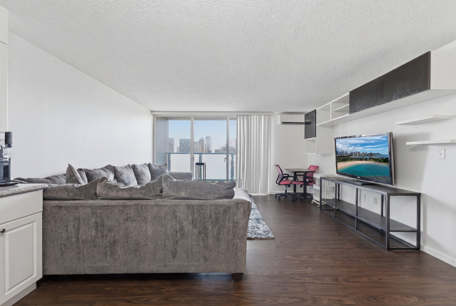 Living room looking toward the lanai with city view
