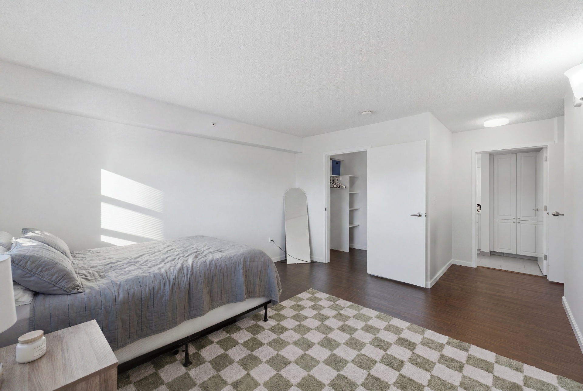 Bedroom showing walk-in closet and ensuite bathroom access